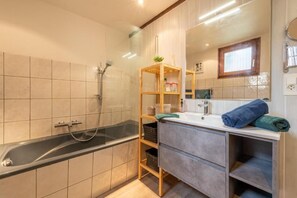 Combined shower/tub, hair dryer, towels, soap