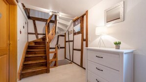 A staircase with wooden steps and a white wall. - Charming Alsatian triplex house rated 3*, Ribeauvillé center (Ribeauvillé)