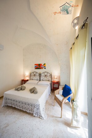 Habitació doble, vistes al jardí (Granaio) | Minibar, caixa forta a l'habitació i decoració individual