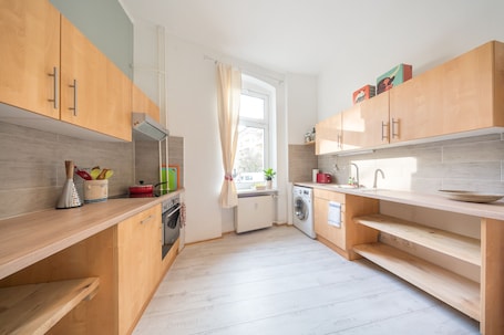 Apartment, 3 Bedrooms | Private kitchen | Full-size fridge, oven, stovetop, coffee/tea maker