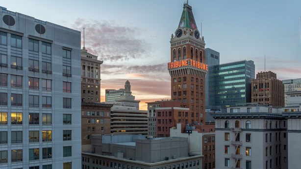 A cityscape with a prominent Tribune Tower and various buildings. - Hampton Inn Oakland Downtown-City Center (Oakland)