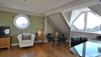 Executive Penthouse, 2 Bedrooms | Living area | Flat-screen TV, DVD player