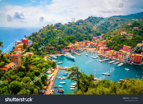 A coastal town with colorful buildings, a marina with boats, and a tower. - B&B La Terrazza Sui Fieschi (Cogorno)