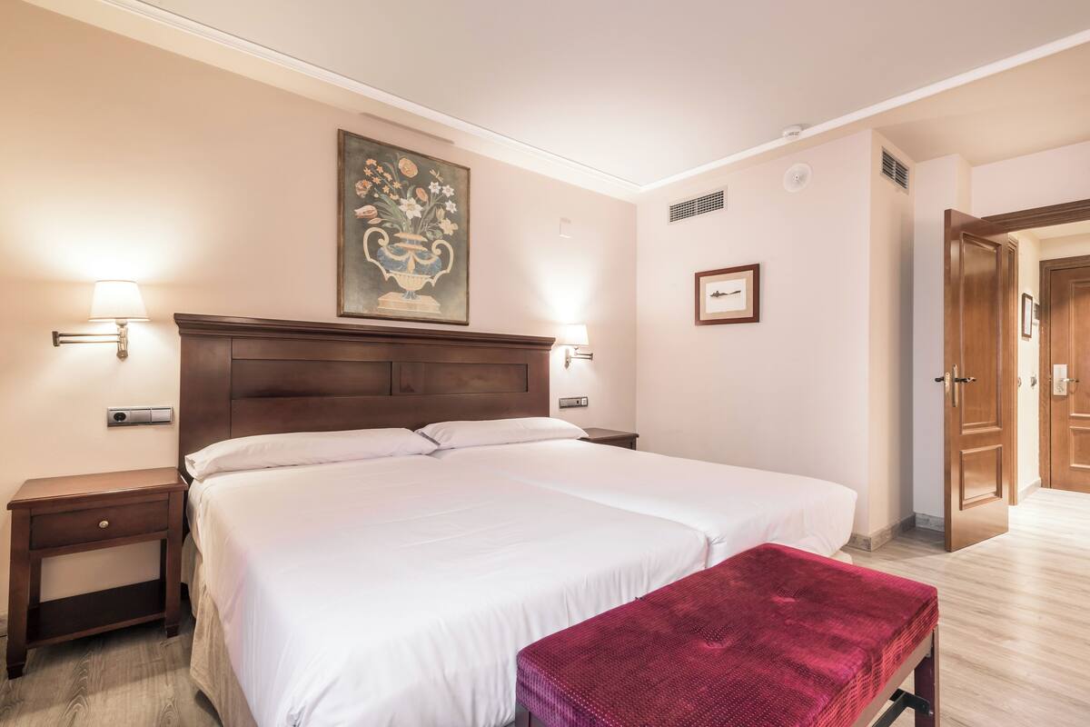 In-room safe, blackout curtains, iron/ironing board, bed sheets