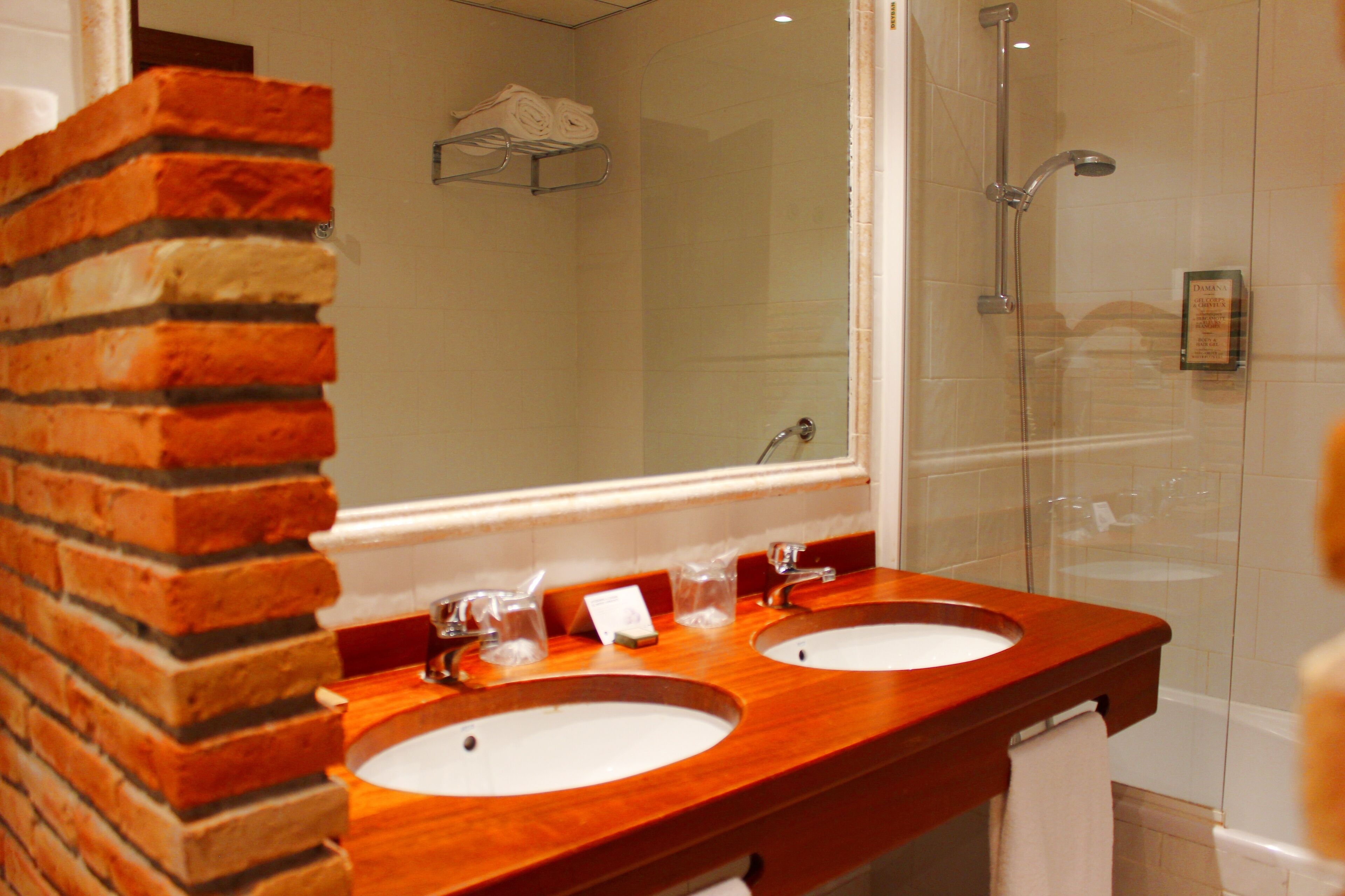 bathtub, deep-soaking bathtub, hair dryer, towels