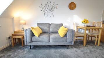 Basic Apartment, 1 Bedroom | Living area | Flat-screen TV