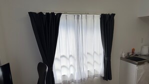 A room with a window, a desk, a chair, a sink, and a mirror. - Olympic Park First Choice Near Shibuya (Setagaya)