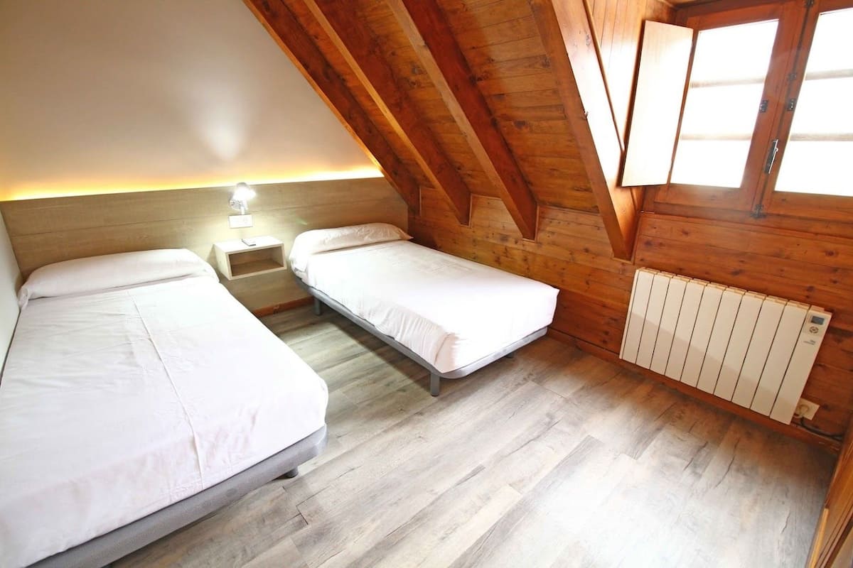 Twin Room | Blackout drapes, iron/ironing board, free cribs/infant beds, bed sheets