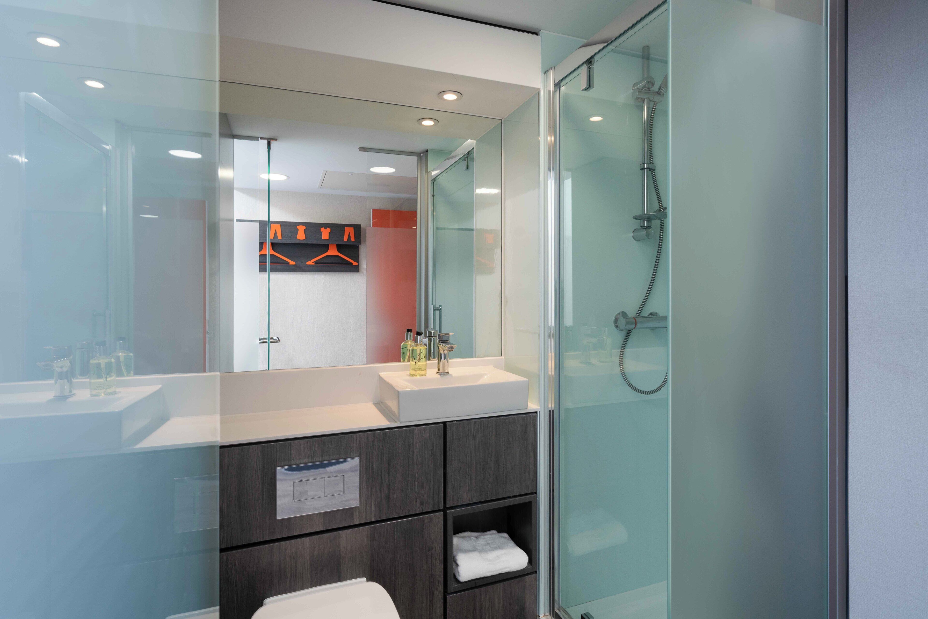 Shower, eco-friendly toiletries, hair dryer, towels