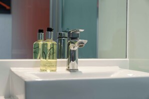 Shower, eco-friendly toiletries, hair dryer, towels