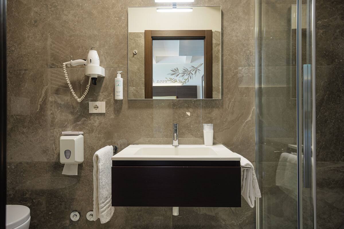 superior quadruple room | bathroom | shower, free toiletries, hair dryer, bidet