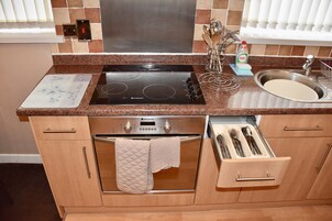 Family Apartment, 2 Bedrooms | Private kitchen | Full-sized fridge, microwave, oven, stovetop