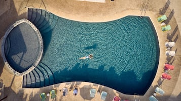 Seasonal outdoor pool, open 9:00 AM to 7:00 PM, pool umbrellas