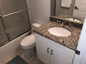 Combined shower/tub, hair dryer, towels, soap