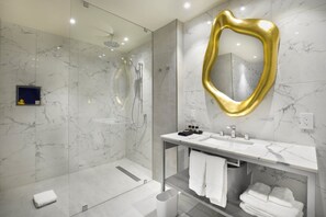 Separate tub and shower, designer toiletries, hair dryer, slippers