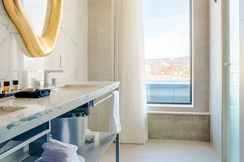 Superior Room, Partial River View | Bathroom | Separate tub and shower, designer toiletries, hair dryer, slippers