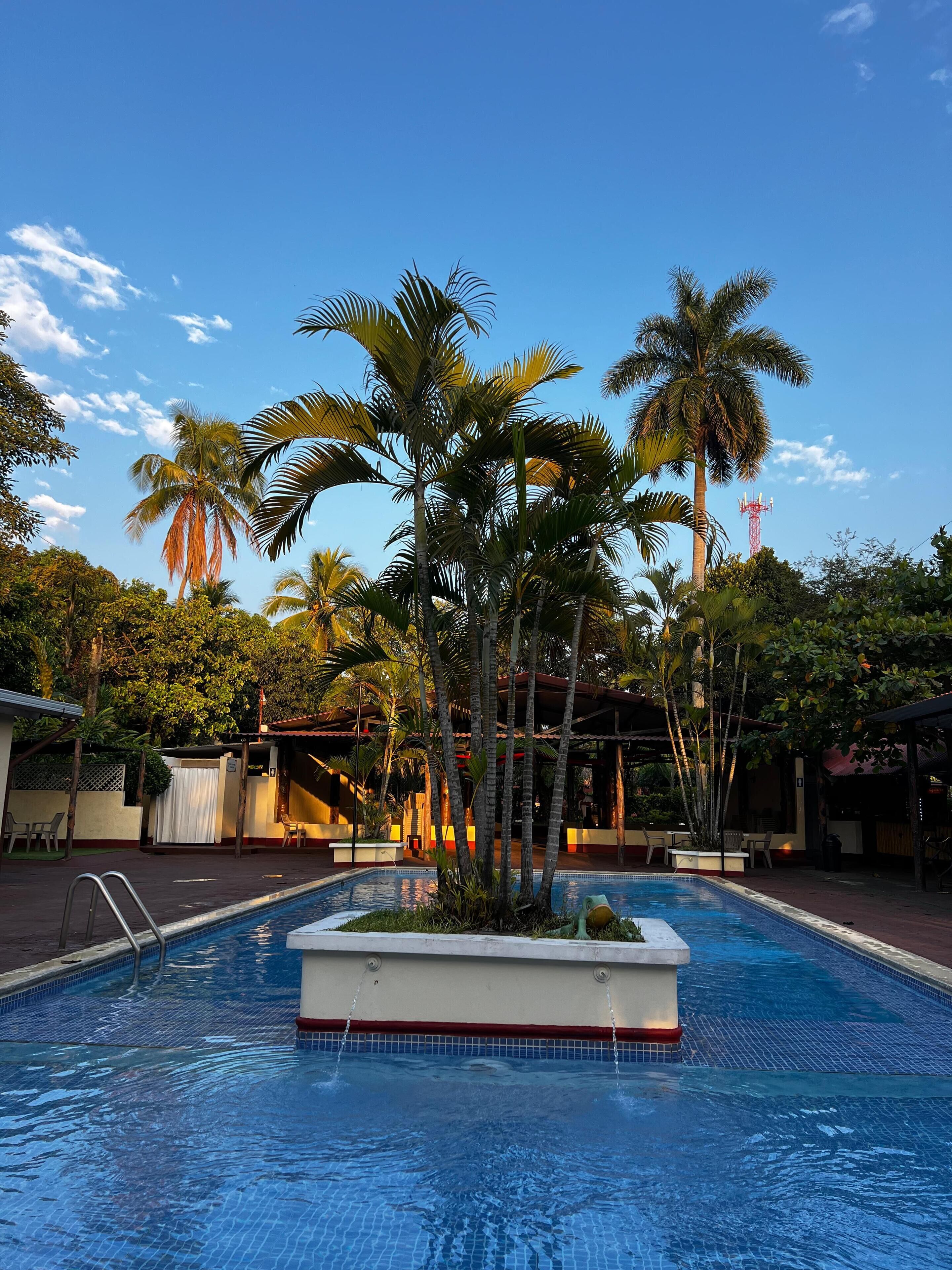 2 outdoor pools, open 7 AM to 10 PM, pool umbrellas