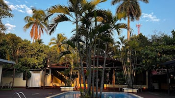 2 outdoor pools, open 7 AM to 10 PM, pool umbrellas