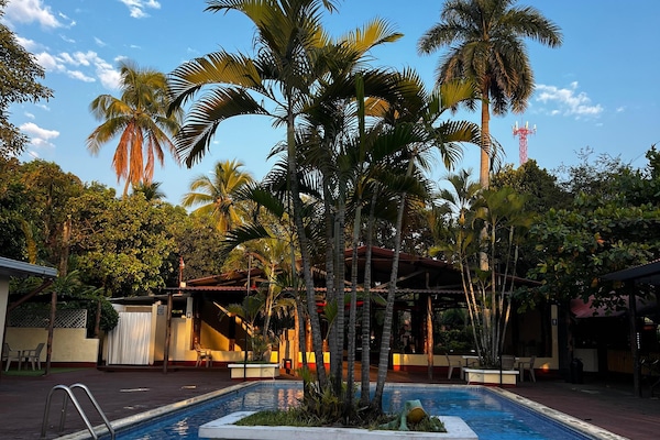 2 outdoor pools, open 7 AM to 10 PM, pool umbrellas