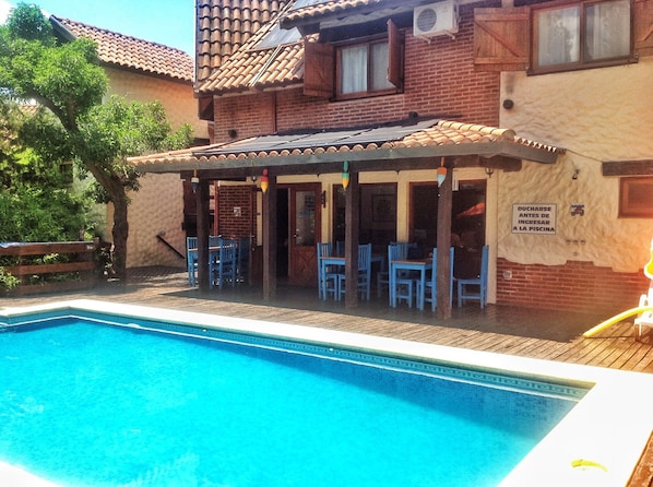 Outdoor pool, open 9 AM to 8 PM, pool loungers