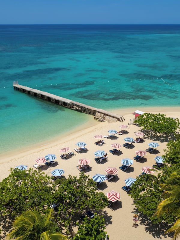 On the beach, white sand, beach umbrellas, beach towels
