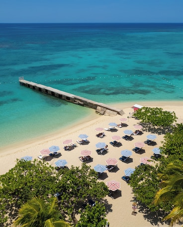 On the beach, white sand, beach umbrellas, beach towels