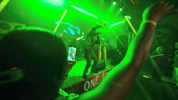 A concert with a stage and audience.