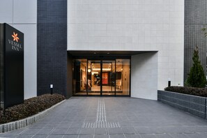 A modern building with a sign reading "Vessel Inn." - Vessel Inn Chiba Station (Chiba)
