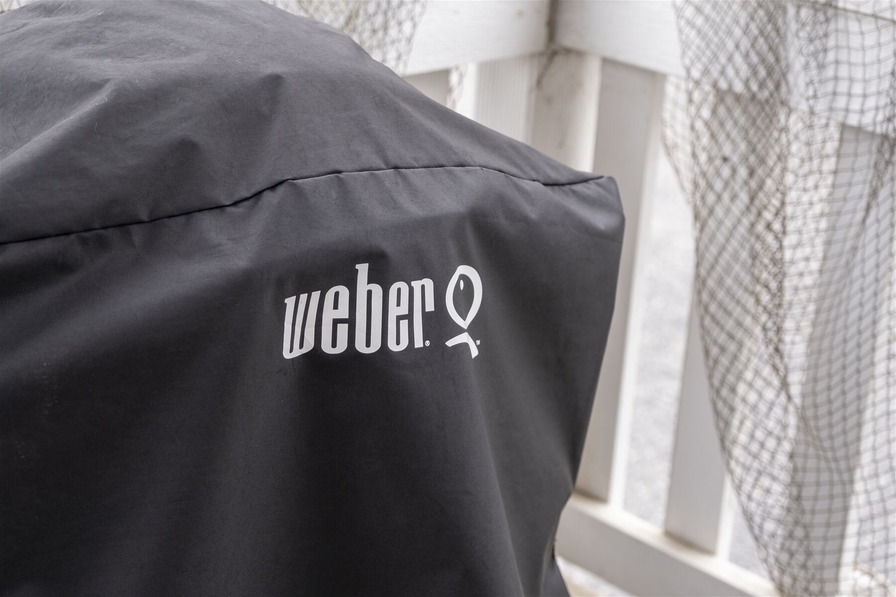 A black bag with the logo "weber" on it.
