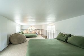 A room with a high ceiling, a balcony with a railing, and a view of the outside. - Emmanuel - WOW Right at the mouth of the Noyo harbor with views of the mighty Pacific ocean. (Fort Bragg)