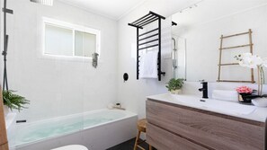 Bathtub, hair dryer, towels
