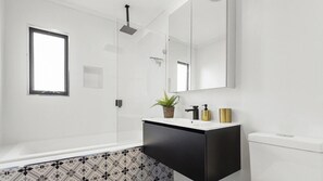 Bathtub, hair dryer, towels