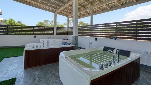 A covered outdoor spa area with multiple tubs and a large central tub. - Shamaz Galle (Galle)