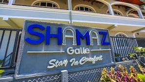 A hotel sign with the name 'SHAMZ Galle' and the tagline 'Stay In Comfort'. - Shamaz Galle (Galle)