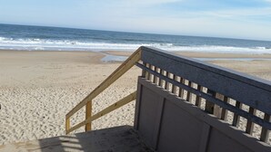 A wooden staircase leading to a beach with a view of the ocean. - Bethany's Hidden Treasure and Hide Away 4Br that Sleeps 12 w/Game Room in Garage (Ocean View)