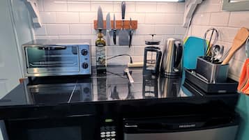 Fridge, microwave, stovetop, coffee/tea maker