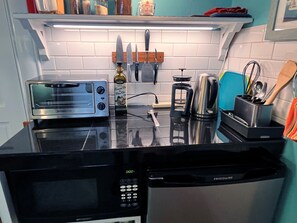 Fridge, microwave, stovetop, coffee/tea maker
