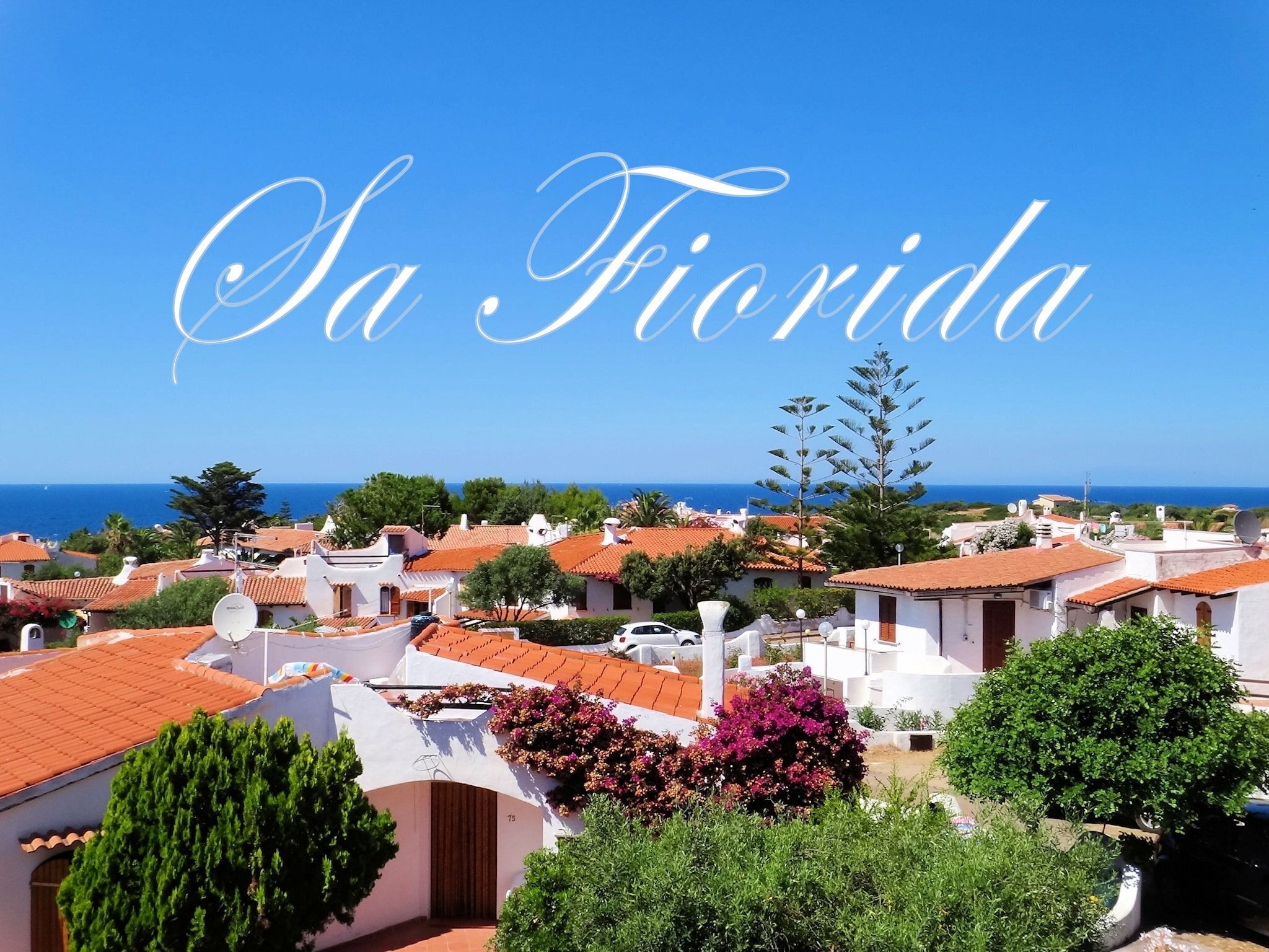 A coastal town with white buildings and red roofs, labeled "Sa Florida".