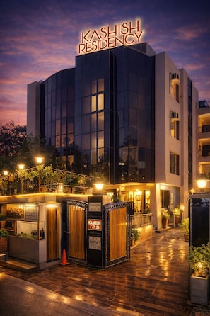 A modern building with a sign reading "KASHISH RESIDENCY" at the top.
