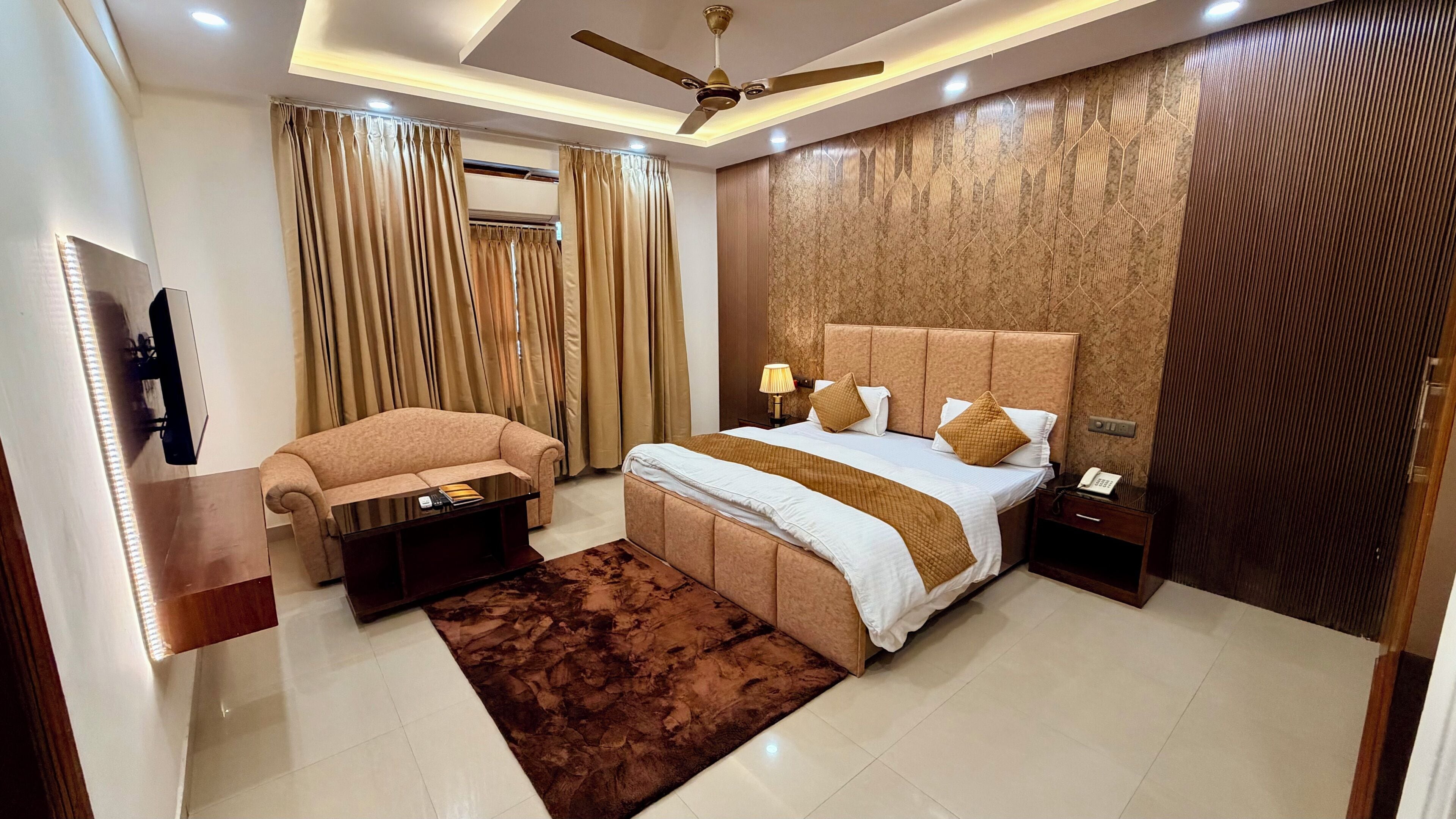 Premium bedding, desk, laptop workspace, iron/ironing board