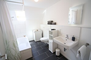 Combined shower/bathtub, hair dryer, towels, soap