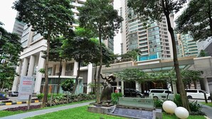 A statue in a landscaped area with a building in the background. - Marc A-23-09 by SYNC (Kuala Lumpur)
