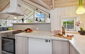 Fridge, stovetop, dishwasher, coffee/tea maker