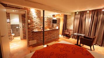 Deluxe Double Room | Living area | Flat-screen TV