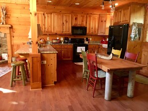 Full Sized Dining Table in Spacious Well Equipped Kitchen