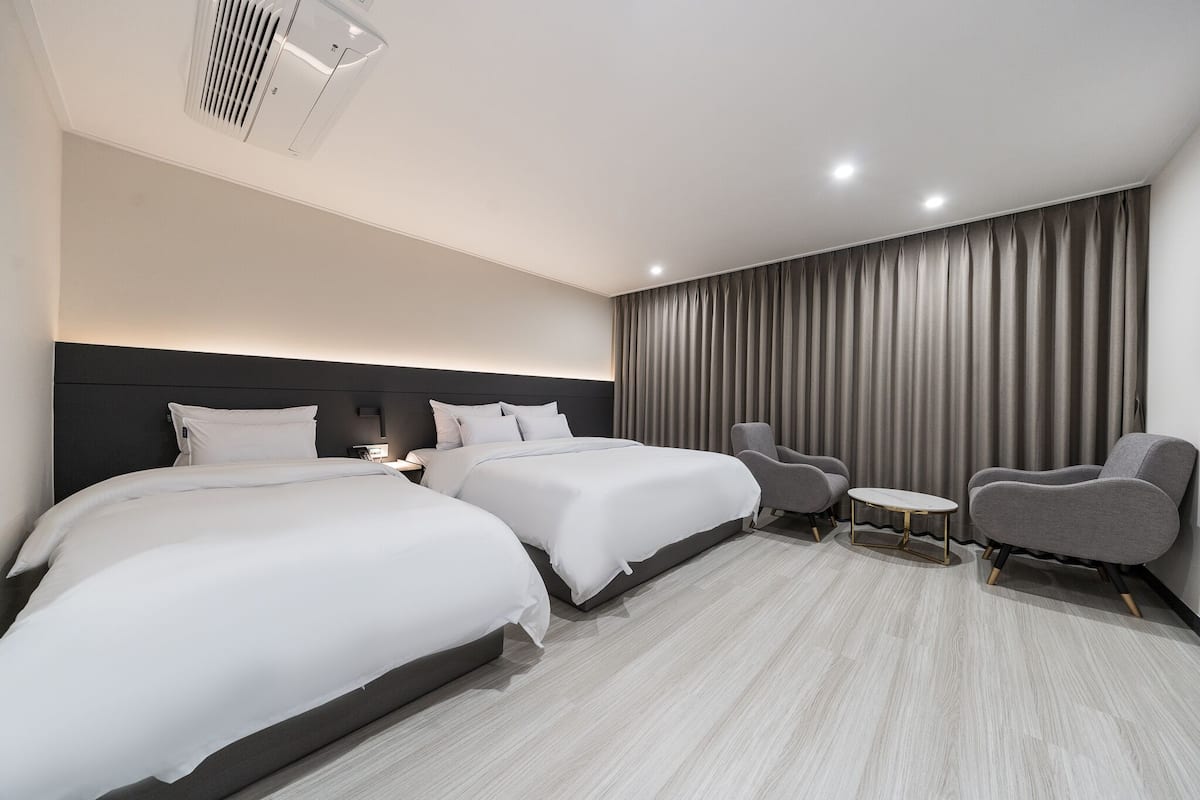 deluxe twin | bathroom | separate bathtub and shower, designer toiletries, hair dryer, bathrobes