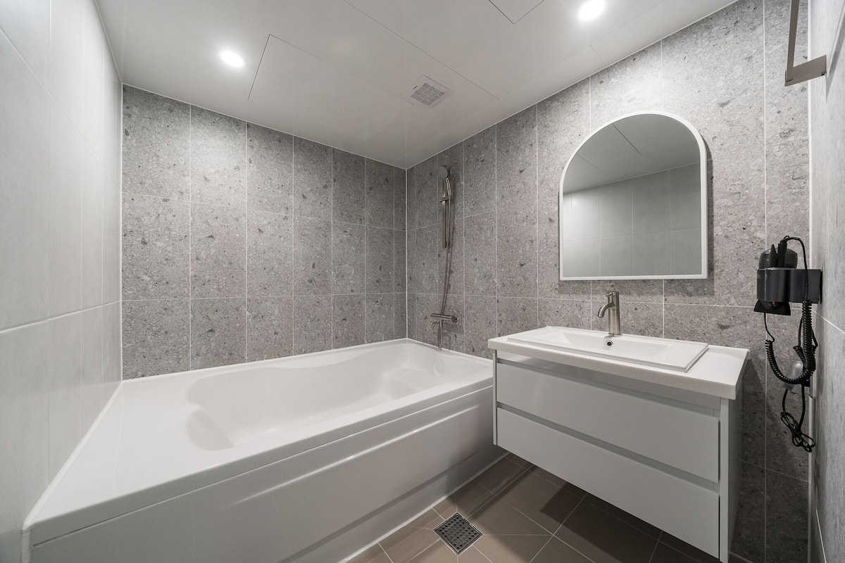 separate bathtub and shower, designer toiletries, hair dryer, bathrobes