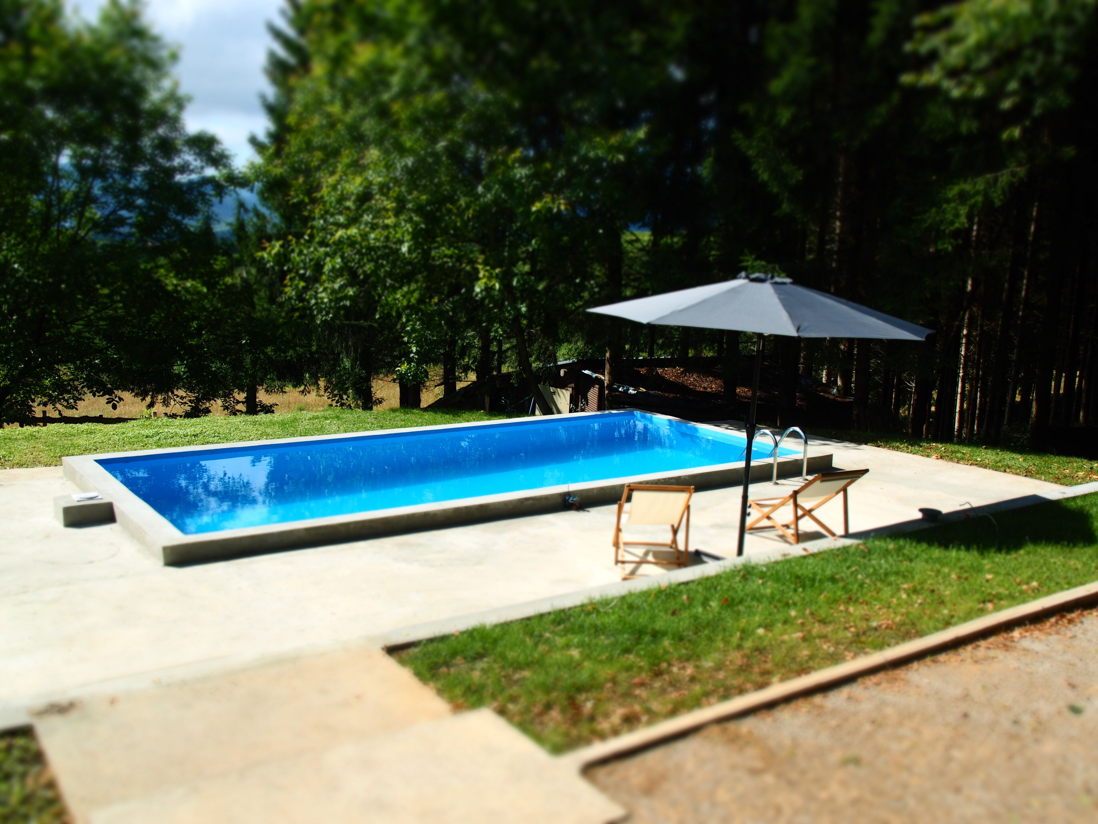 Outdoor pool, pool umbrellas, pool loungers