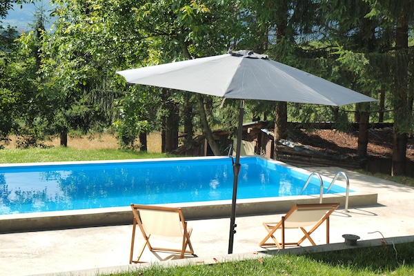 Outdoor pool, pool umbrellas, sun loungers