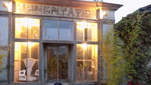A building with a sign reading "HOTEL" and a "H" symbol indicating a hotel.